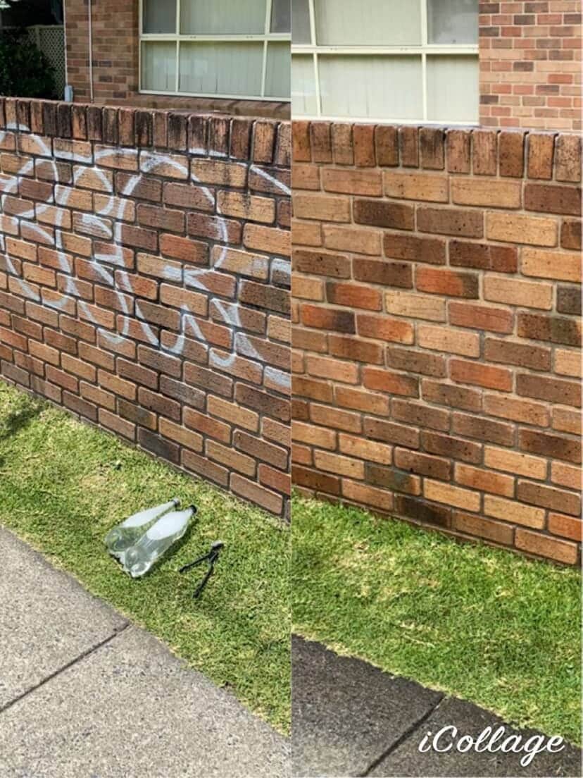 Graffiti spray paint on a brick fence wall before professional removal in Coffs Harbour