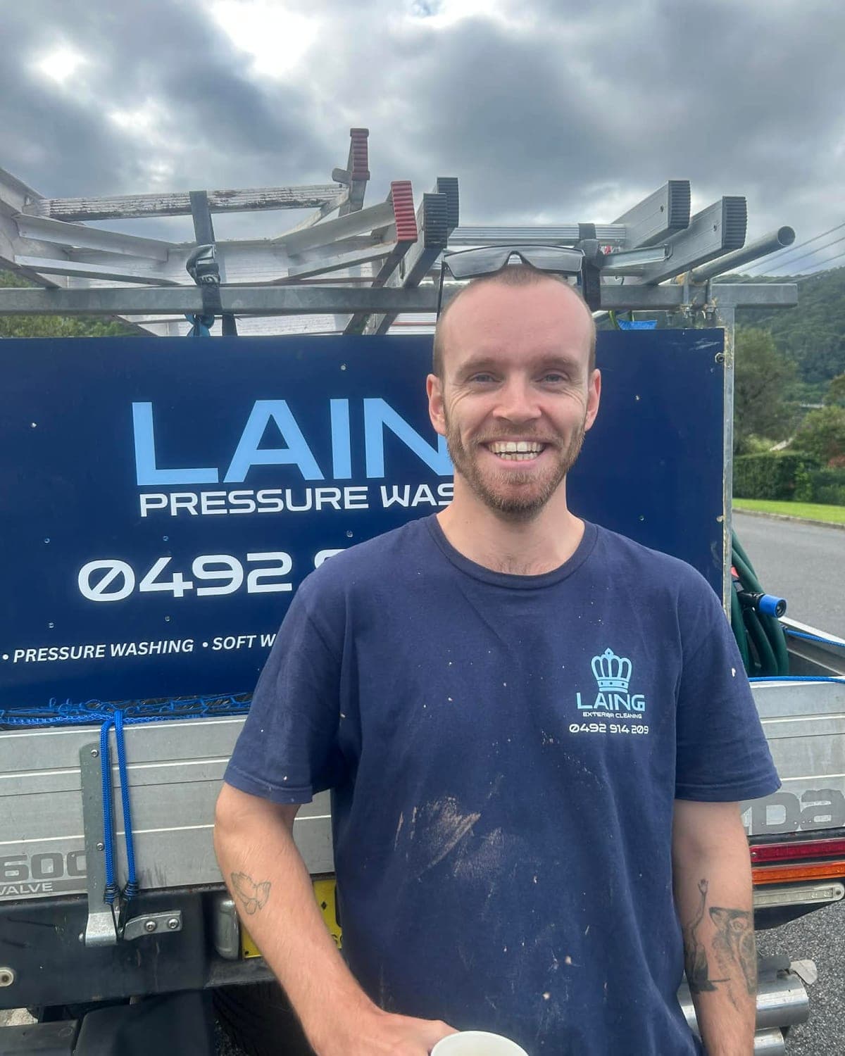 Matt Laing, founder of Laing Pressure Washing, on a job in Coffs Harbour